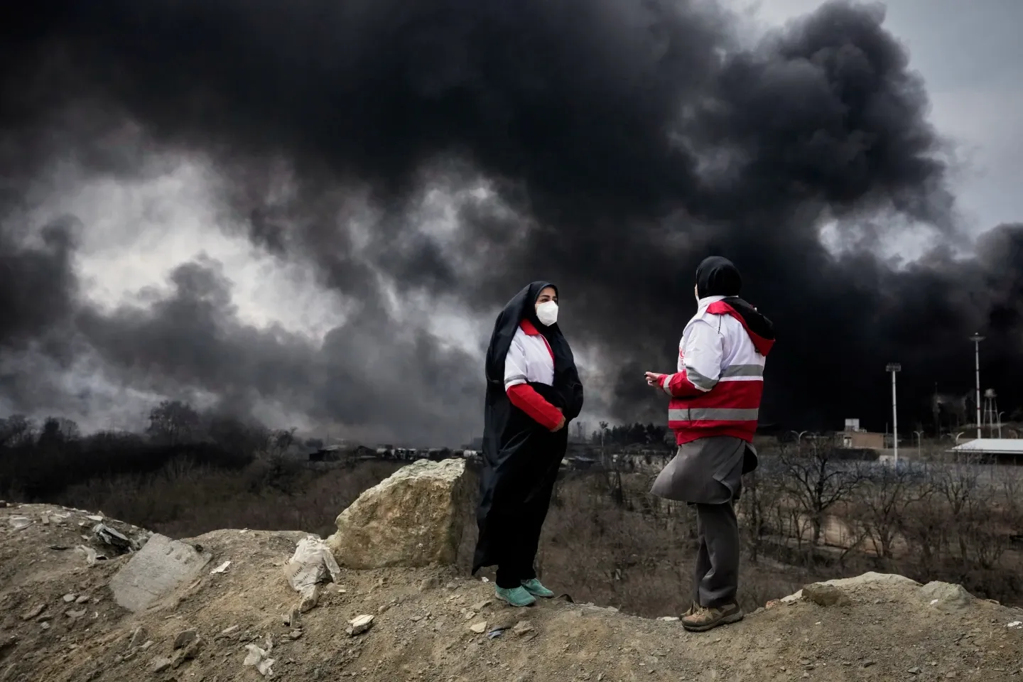 After attacks on Iran’s oil facilities, toxic black rain endangers the public