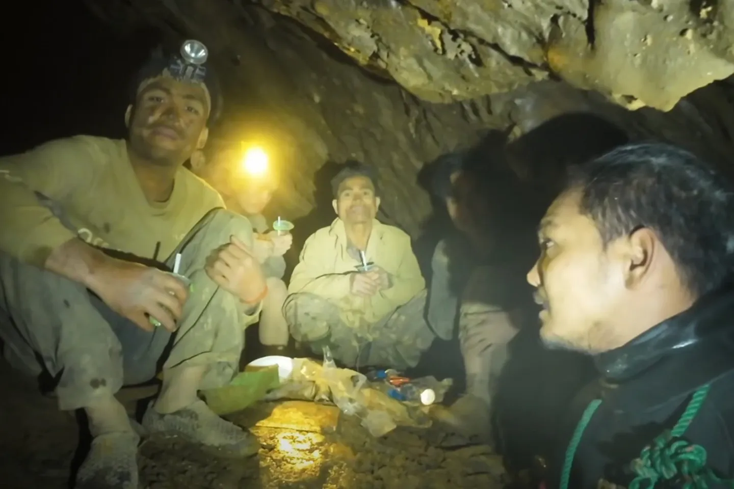 Rescuers free 4 men who remained trapped in a flooded Laos cave, search for 2 still missing