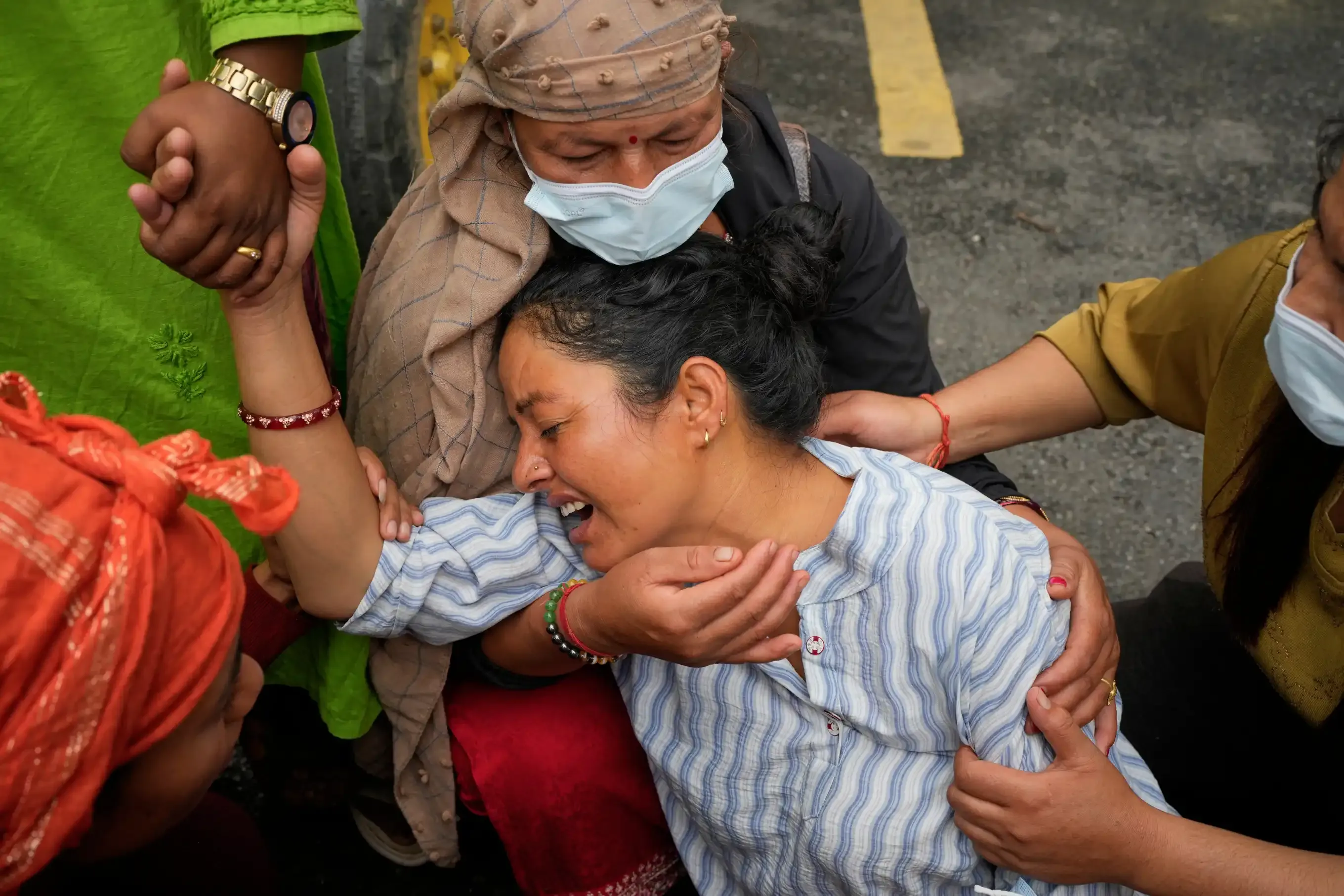 Family Bids Farewell Amid Mass Burials of Flood Victims in Nepal